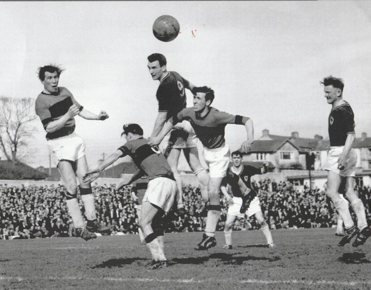 Donal Leahy, who scored Cork Celtic's equaliser against Slavia Sofia, heads past three Bohemians' defenders during the 1964 FAI Cup semi-Final win at Flower Lodge, while Al Casey and Austin Noonan look on. Donal Leahy, who scored Cork Celtic's equaliser against Slavia Sofia, heads past three Bohemians' defenders during the 1964 FAI Cup semi-Final win at Flower Lodge, while Al Casey and Austin Noonan look on.