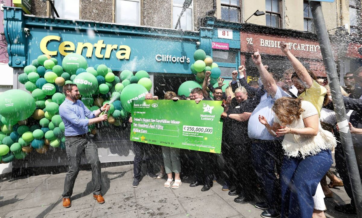 Clifford’s Centra celebrate selling Ireland’s biggest ever EuroMillions jackpot. Pictured is Cian Murphy CEO National Lottery alongside store manager Simon Champ and the team of Clifford’s Centra on Shandon Street in Cork City centre. Photo Mac Innes Clifford’s Centra celebrate selling Ireland’s biggest ever EuroMillions jackpot. Pictured is Cian Murphy CEO National Lottery alongside store manager Simon Champ and the team of Clifford’s Centra on Shandon Street in Cork City centre. Photo Mac Innes
