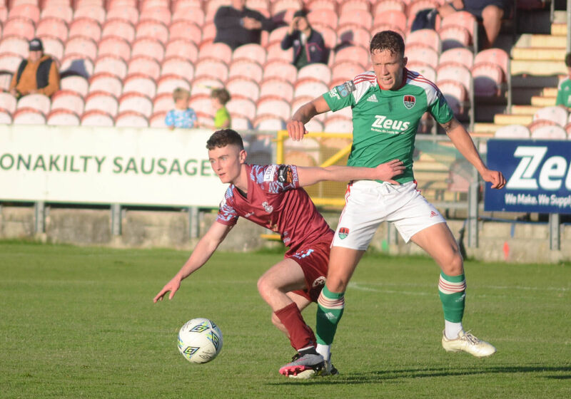 Cobh Ramblers' Liam Kervick trying to hold off Cork City's Colin Henderson. Picture: Howard Crowdy