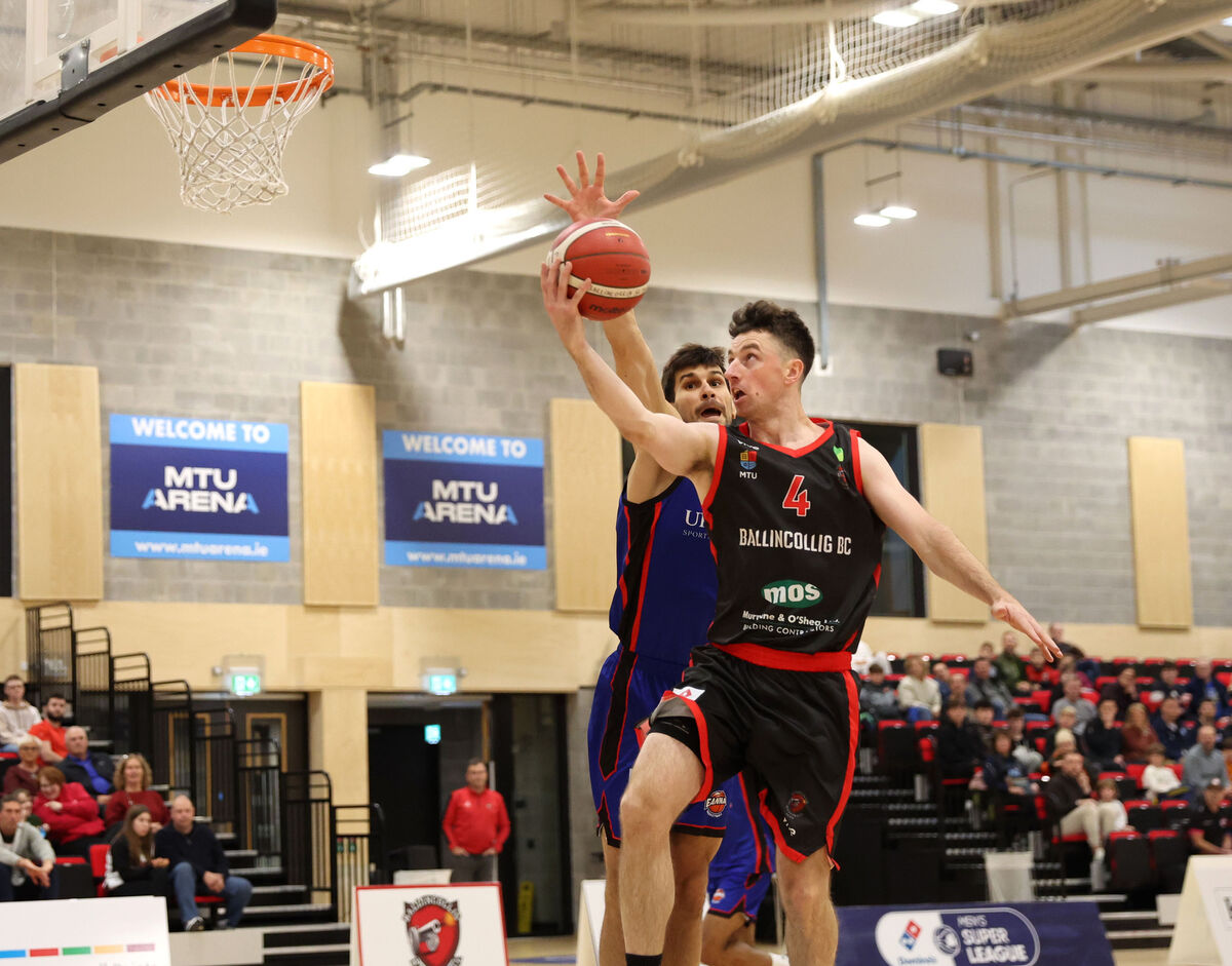  Adrian O'Sullivan, Ballincollig, scores from Stefan Desnica, Eanna, at the MTU Arena. Picture: Jim Coughlan.