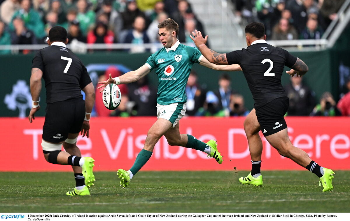 Jack Crowley of Ireland in action against Ardie Savea, left, and Codie Taylor of New Zealand. Pic: Ramsey Cardy/Sportsfile