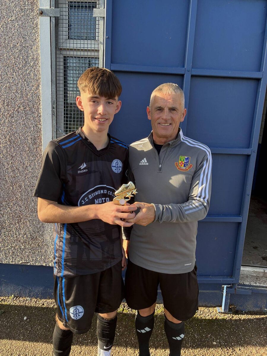 Youth Soccer: Referee Timmy Kelleher presenting the Man of the Match award to Crosshaven player Daniel O’Keeffe after the U17 League 2 game against Leeds.
