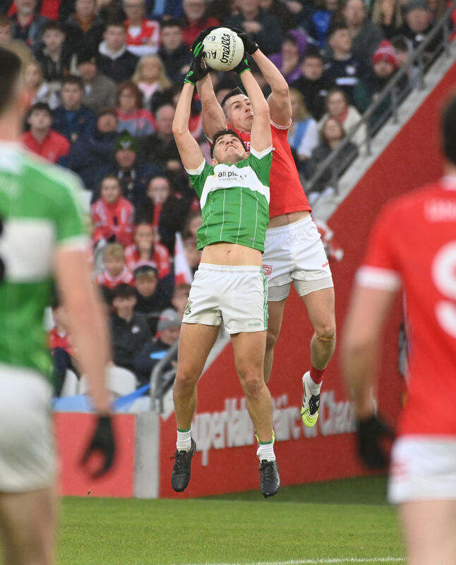 Uibh Laoire's Cathal Vaughan and Aghabullogue's Adam Murphy go high for the ball. Picture: Eddie O'Hare Uibh Laoire's Cathal Vaughan and Aghabullogue's Adam Murphy go high for the ball. Picture: Eddie O'Hare
