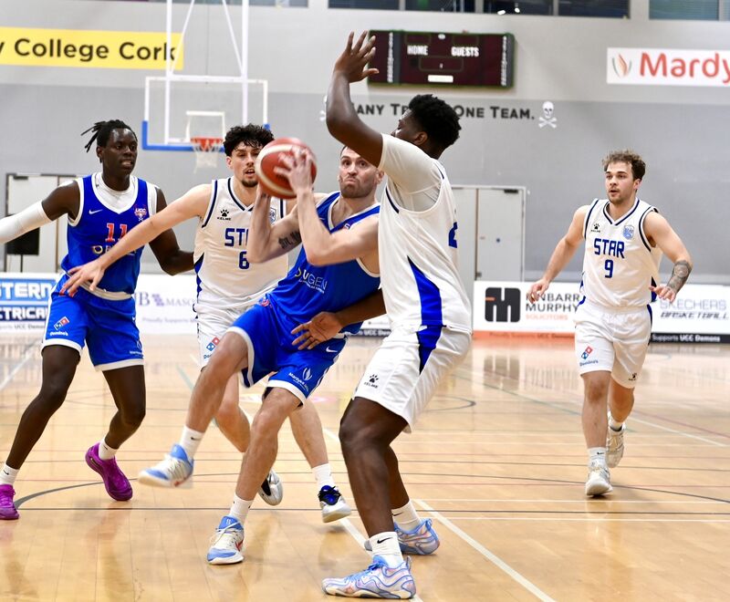  Kyle Hosford battles for UCC Demons. Picture: Larry Cummins