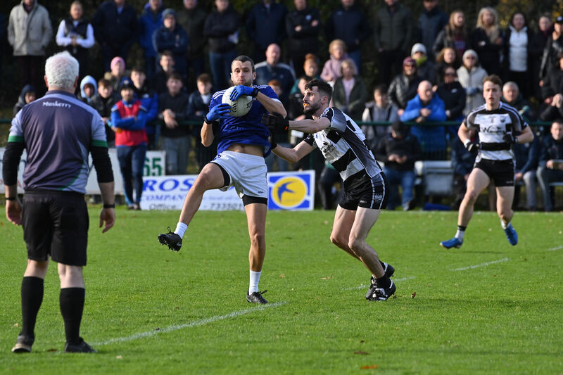 Aghinagh's Matthew McCarthy and Mark Lucey of Donoughmore battle for the ball. Picture: Dan Linehan