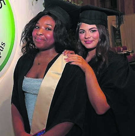 Mary Adedokun and Clodagh O’Flynn, both Interior Architecture &amp; Design, at the class of 2025 Cork College of FET Douglas Street Campus Certificate Ceremony, at City Hall.