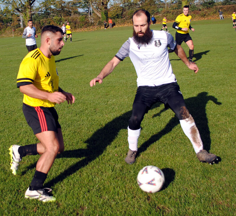 Blackpool Celtic's Michael Buckley and UCC B's Kieran Maher clash for possession. Picture: Barry Peelo. Blackpool Celtic's Michael Buckley and UCC B's Kieran Maher clash for possession. Picture: Barry Peelo.