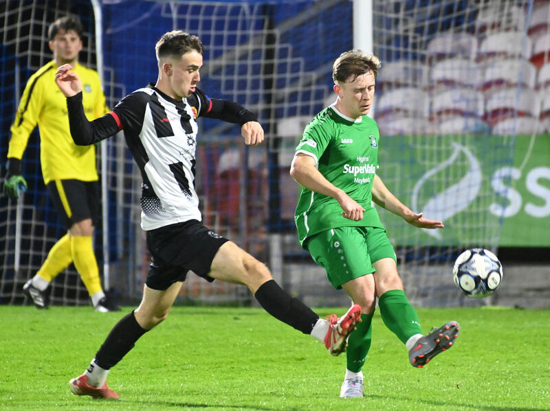 Mayfield United's Scott McCarthy clears from Midleton's Dylan Lyons duirng the Keane Cup final at Turner's Cross. Picture; Eddie O'Hare