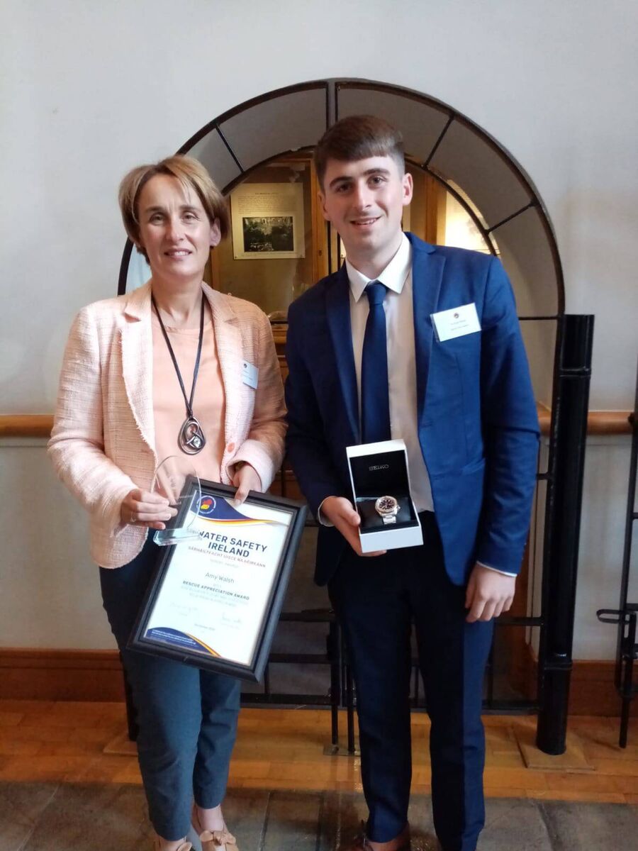 Amy Walsh and her son were honoured for their bravery in assisting a women in difficulty at a Cork beach.