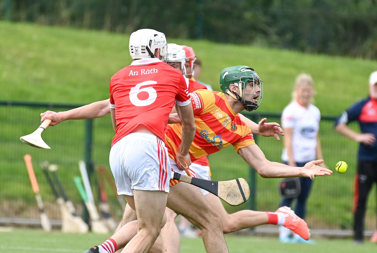  Newcestown's Sean O'Donovan gets his pass away under pressure from Charleville's Jack Buckley, during their Premier SHC clash at Grenagh. Picture: David Keane.