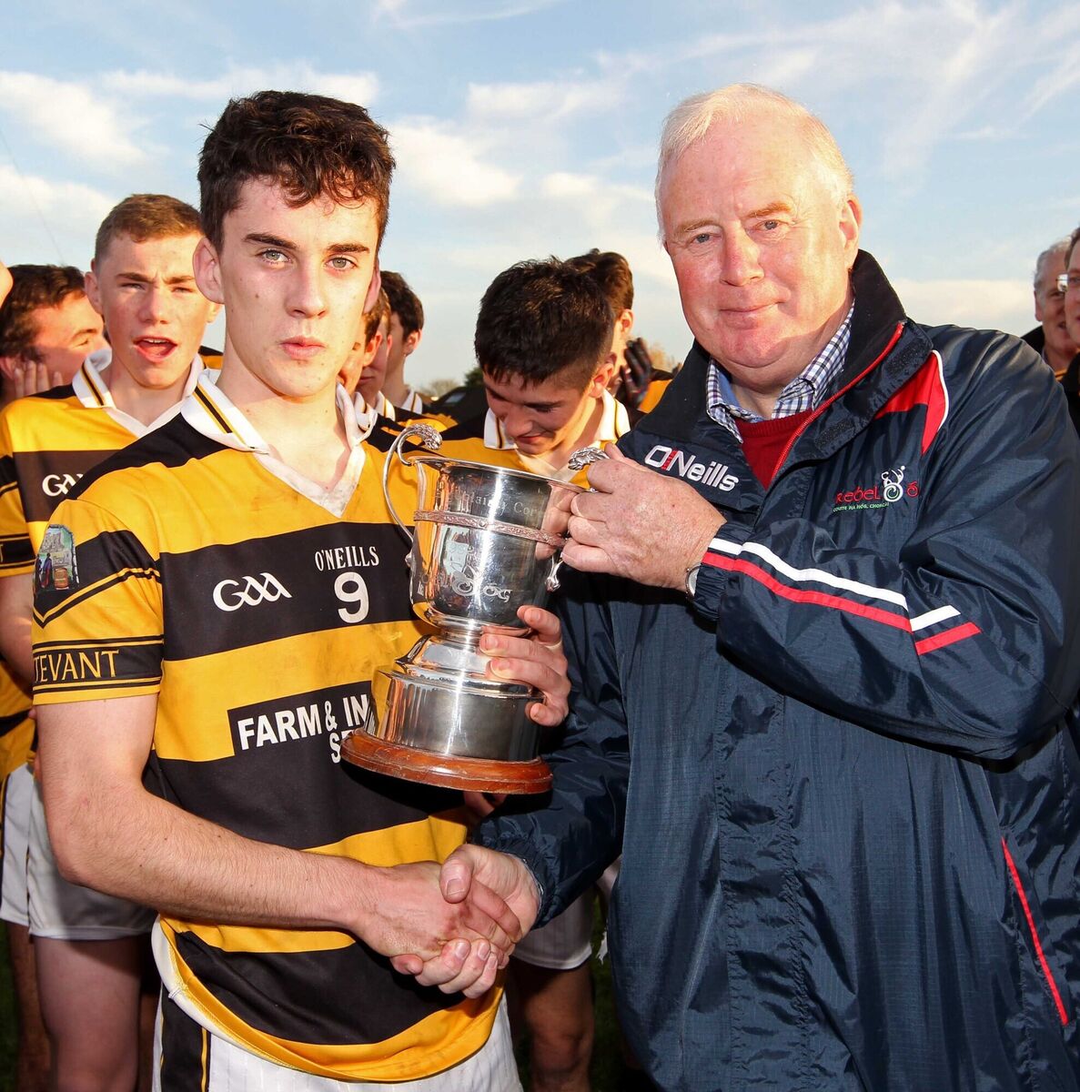 Buttevant captain Seamus Madigan receives the trophy from John Purcell, chairman of Rebel Óg, after winning the county minor A football championship in 2015. Picture: Jim Coughlan Buttevant captain Seamus Madigan receives the trophy from John Purcell, chairman of Rebel Óg, after winning the county minor A football championship in 2015. Picture: Jim Coughlan