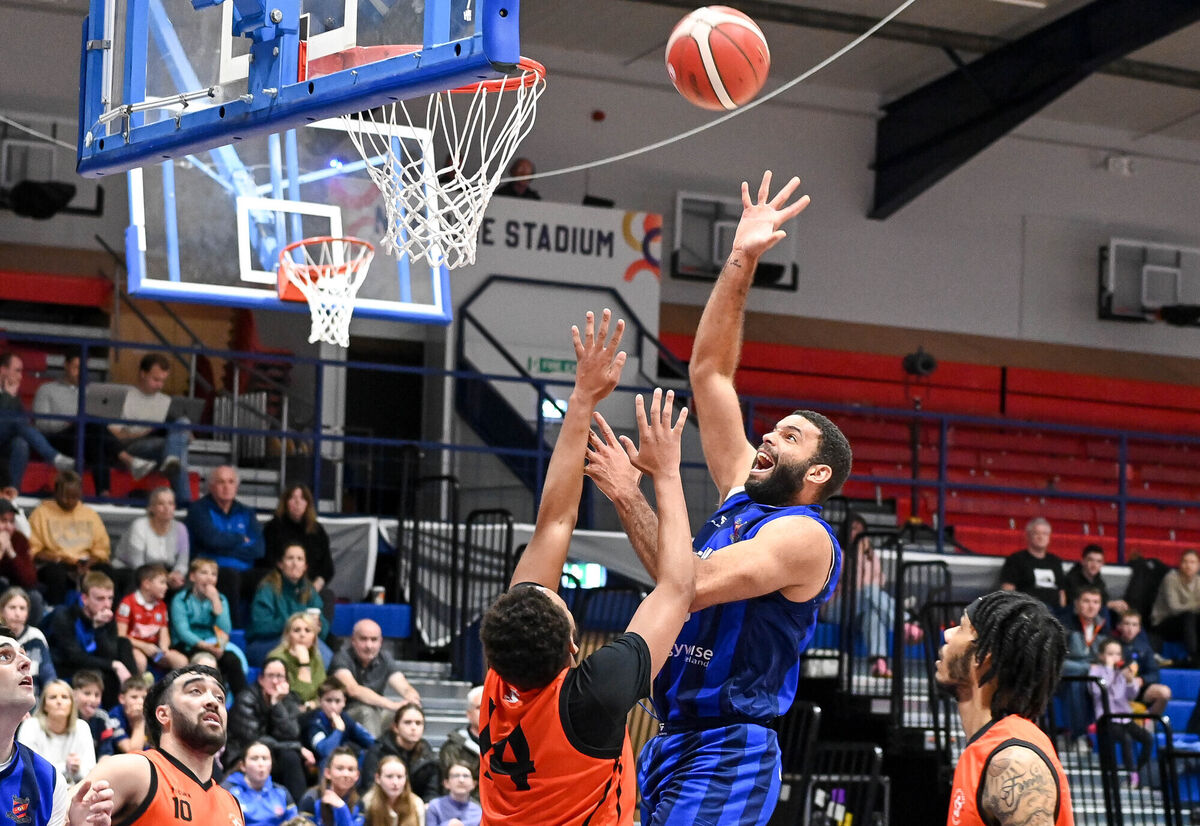  Neptune's Gregoria Adon looks for the hoop under pressure from Sligo's Ja'zere Noel. Picture: David Keane