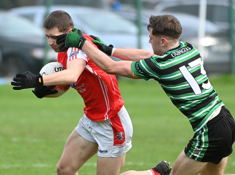Beara's Danny Walsh is tackled by Douglas' Eoin O'Flynn. Picture: Eddie O'Hare Beara's Danny Walsh is tackled by Douglas' Eoin O'Flynn. Picture: Eddie O'Hare