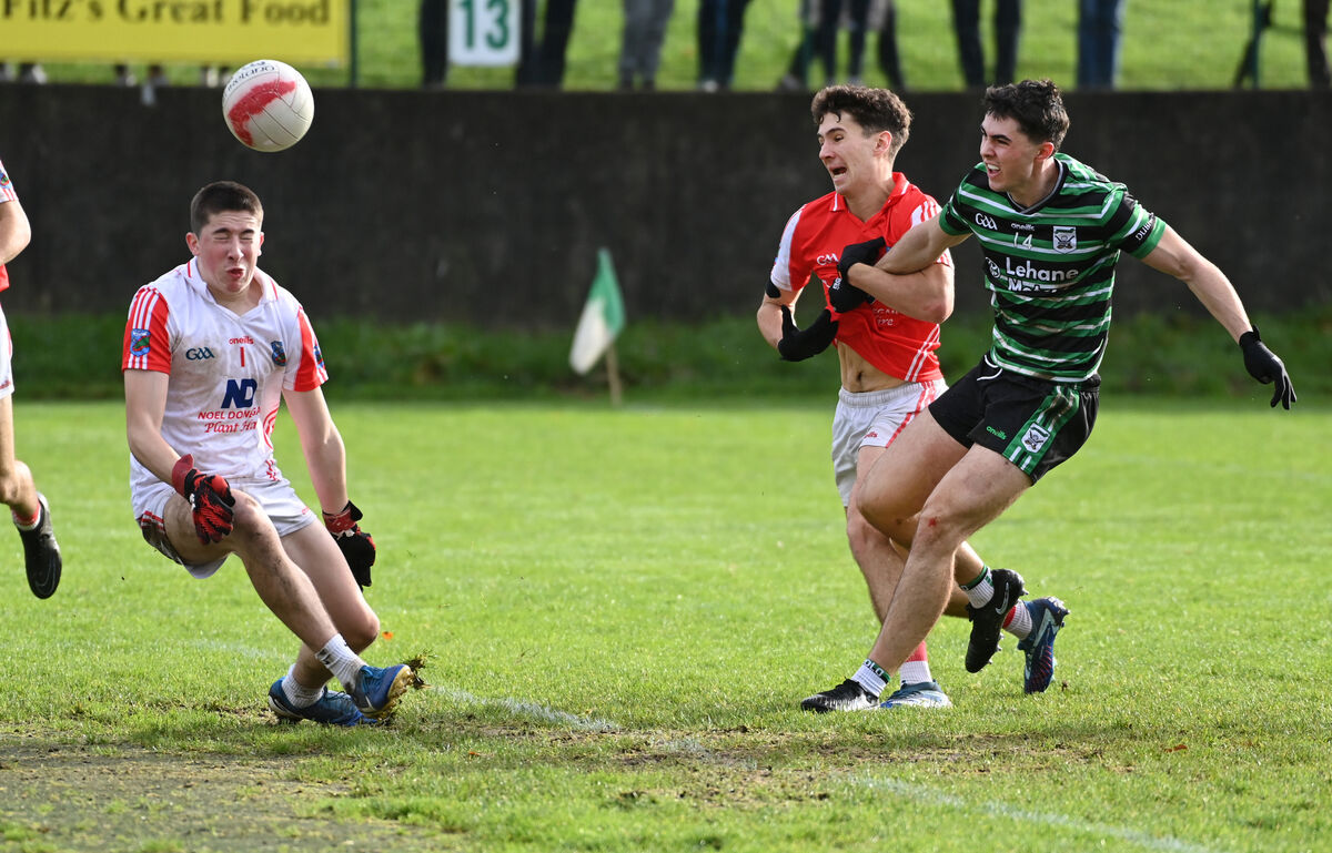 Douglas' Sean Coakley shoots past Beara's Mark Dowing and goalkeeper Joseph O'Donovan to score a point during the McCarthy Insurance Group U21 A FC semi-final at Castle Grounds, Macroom. Picture: Eddie O'Hare