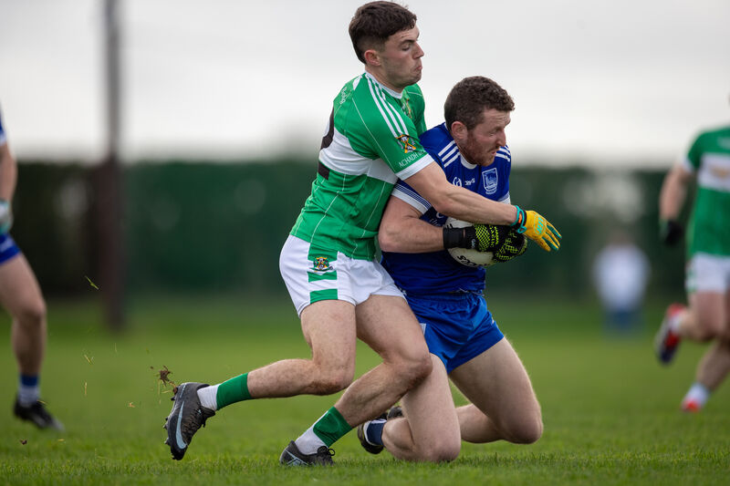 Aghabullogue's Pauric O’Sullivan tackles Thurles Sarsfields' Rory Dwan. Picture: Diarmuid Brennan Aghabullogue's Pauric O’Sullivan tackles Thurles Sarsfields' Rory Dwan. Picture: Diarmuid Brennan