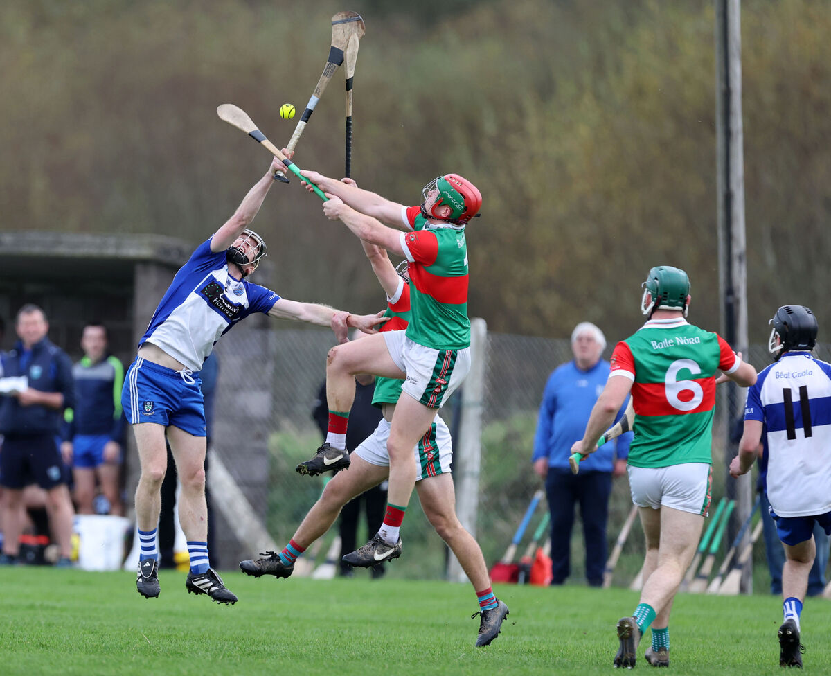 James Byrne and Colin O'Flynn, Ballinora, rise high with Barry Dwyer, Belgooly. Picture: Jim Coughlan.