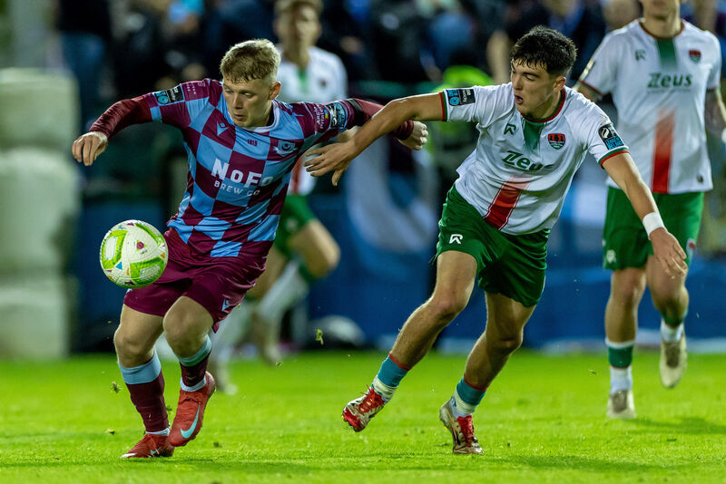 Drogheda United’s Joshua Thomas with Matthew Kiernan of Cork City during the Premier Division. Picture: ©INPHO/Morgan Treacy