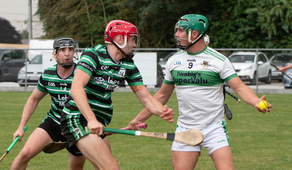 Kanturk's Brian O'Sullivan holds onto the sliotar as he is about to be challenged by Eoin O'Flynn of Douglas during their PSHC clash. Picture: Howard Crowdy