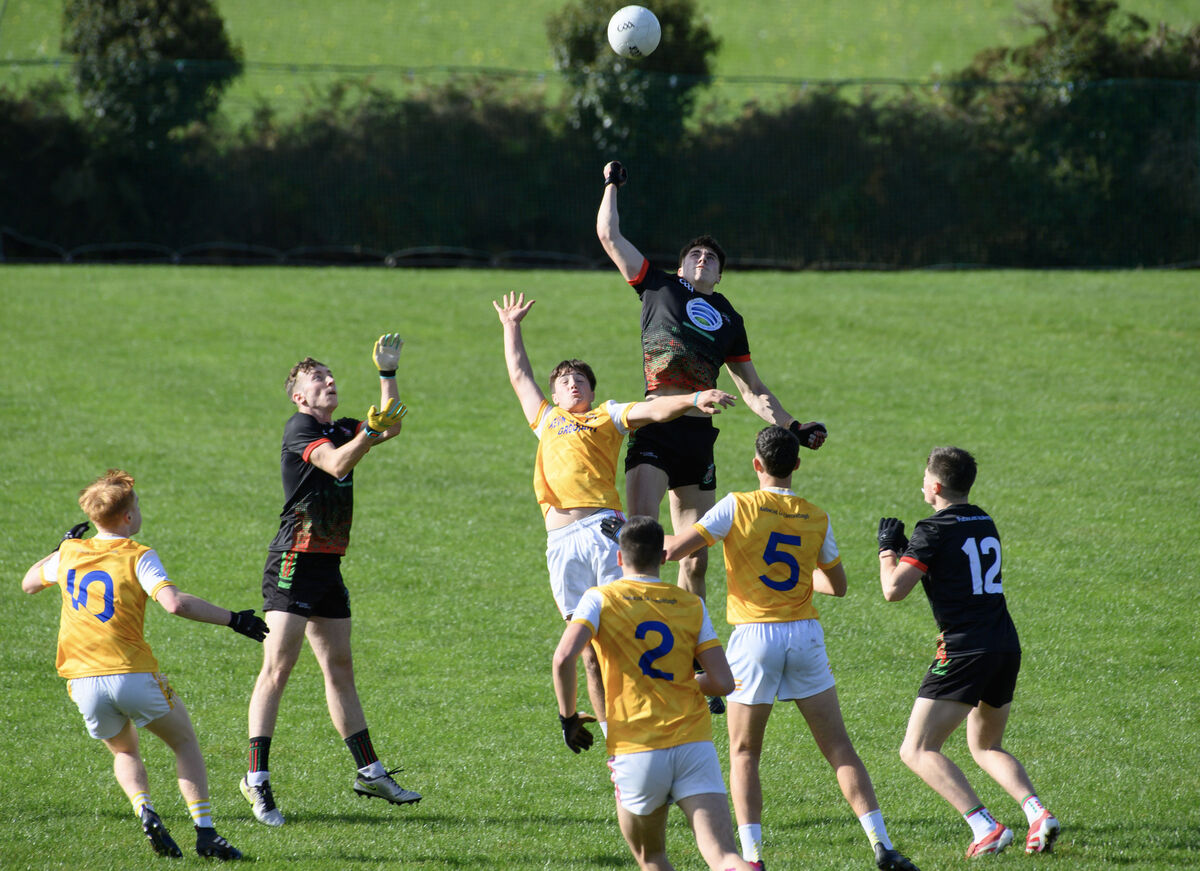  John Murphy of Patrician Academy Mallow and Eddie O'Sullivan of Hamilton High School Bandon contest the dropping ball. Picture: Dan Linehan