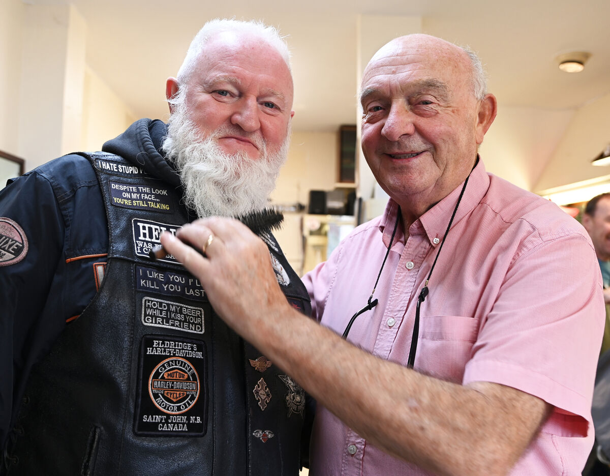 Mick Moriarty (Baldy barber) with customer Martin Meaney on the final day of Mick Moriarty barbers after 59 years in Blackpool. Picture; Eddie O'Hare