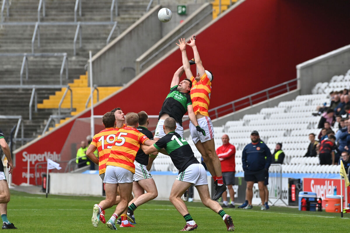  Nemo Rangers Briain Murphy and Seán O'Donovan, Newcestown contest this high ball in their McCarthy Insurance Group Senior FC semi-final match at Páirc Uí Chaoimh. Picture: Dan Linehan