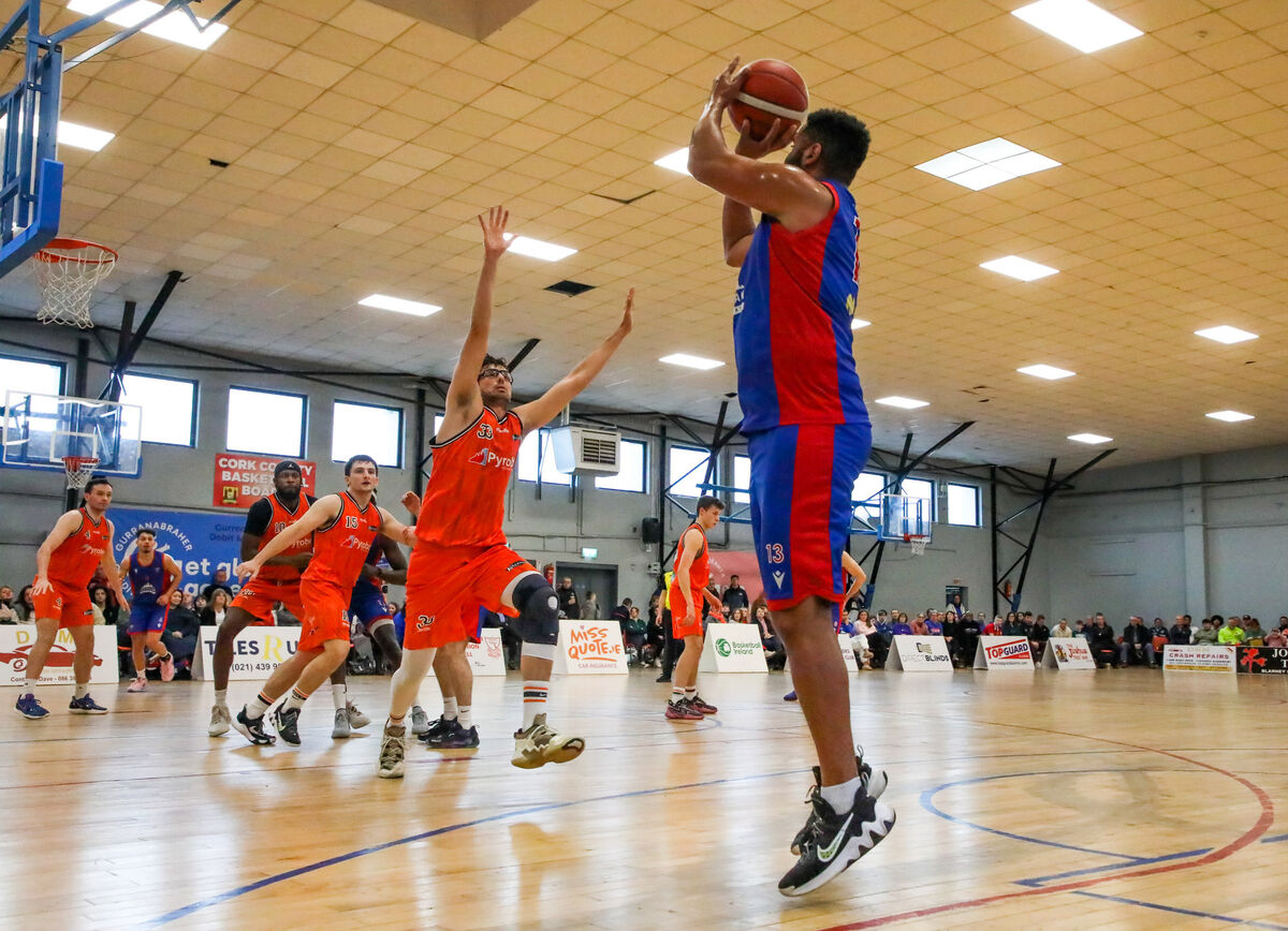  UCC Demons' Carleton Cuff fires a corner three at the Parochial Hall. Picture: David Creedon