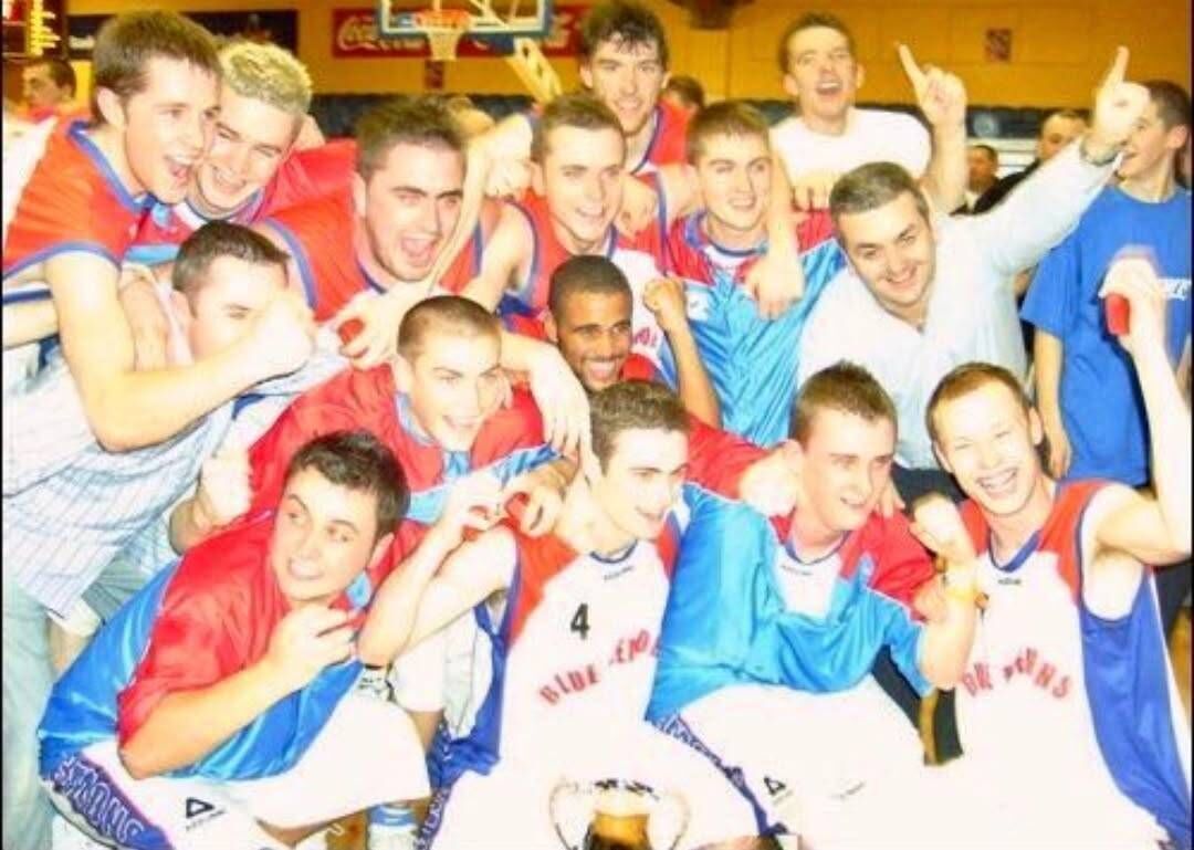 Carleton Cuff, centre with his Blue Demons teammates after winning the U20 National Cup.