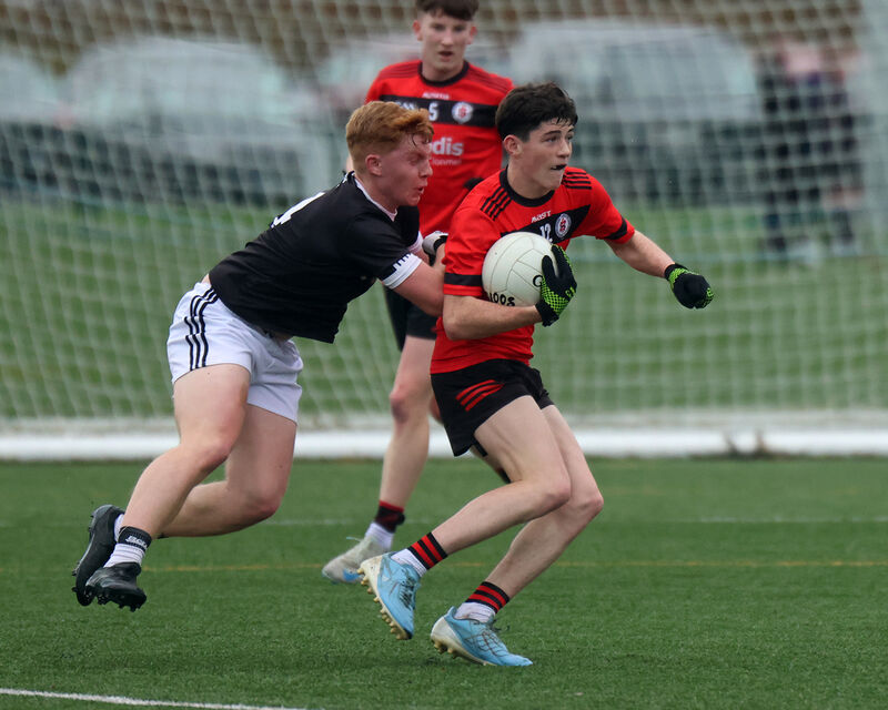 Briain Morrisson, Clonmel High School, under pressure from Diarmuid O'Donoghue, St Francis College Rochestown. Picture Brendan: Gleeson