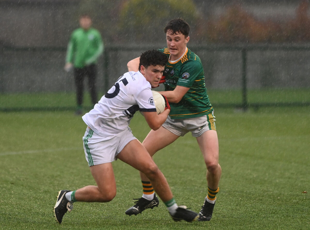 Joe Miskella holds possession despite the attentions of David McCarthy of St Brendan's College. Picture  Larry Cummins