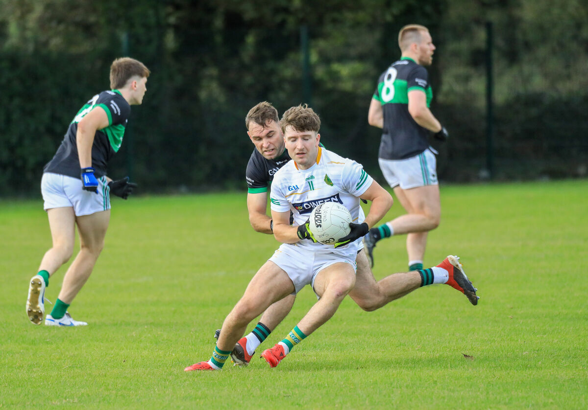 St Michael's Emmett Sheehan tries to turn Nemo's Barry Cripps during the McCarthy Insurance Group PSFC game at Shanbally. Picture: David Creedon