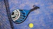 Close up padel or tennis racket and balls
