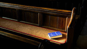 EBM1RD Bible on church pew