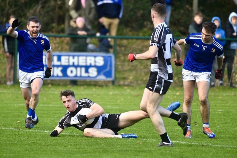 Donoughmore's Seán O'Hanlon tries to hold possession against Aghinagh in the Ross Oil Muskerry JAFC final. Picture: Larry Cummins