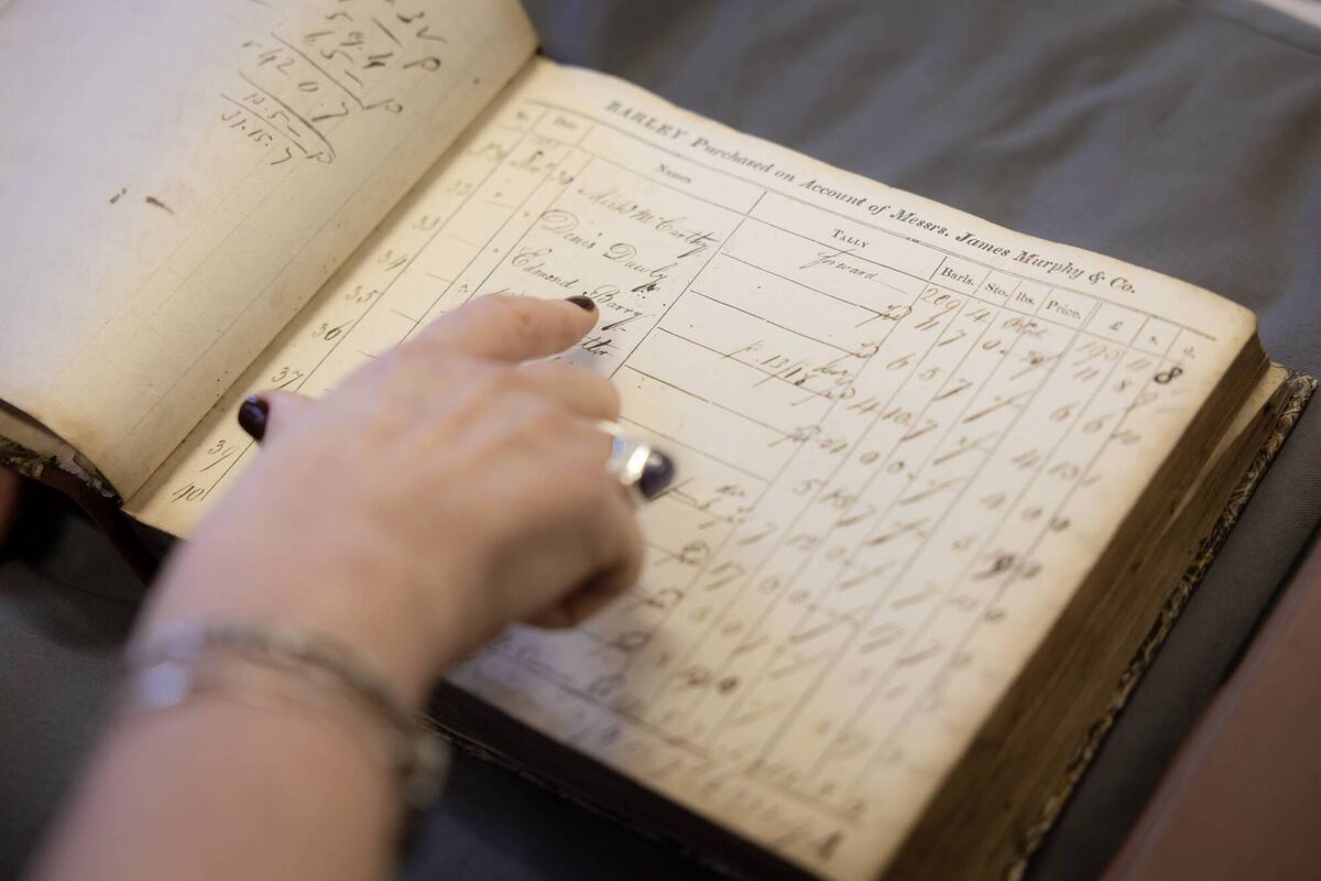 Carol with one of the Midleton Distillery Barley Purchase Books Carol with one of the Midleton Distillery Barley Purchase Books