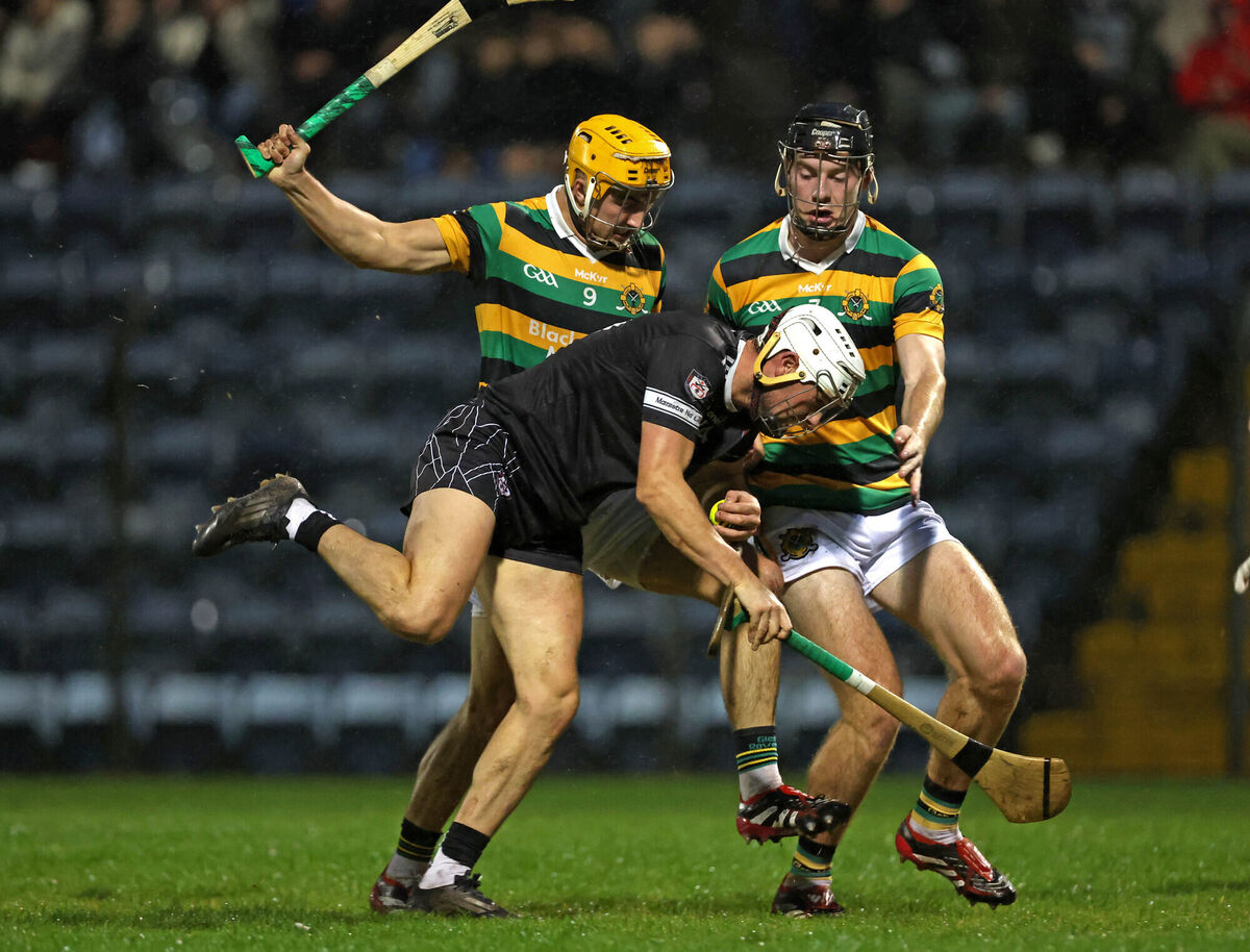  Micheal Mullins and Eoin Downey, Glen Rovers, challenge Cormac Beausang, Midleton during the Cork Premier Senior Hurling Championship quarter final at Pairc Ui Rinn. Picture: Jim Coughlan.