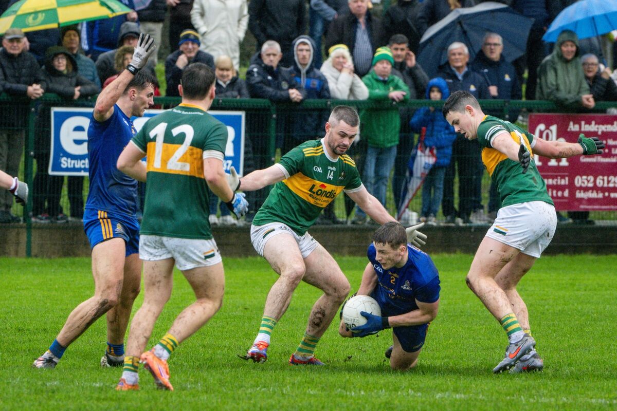 St Finbarr’s Billy Hennessy looks for a passing option under pressure from Clonmel Commercials’ Michael Quinlivan and Seán O'Connor. Picture: Chani Anderson