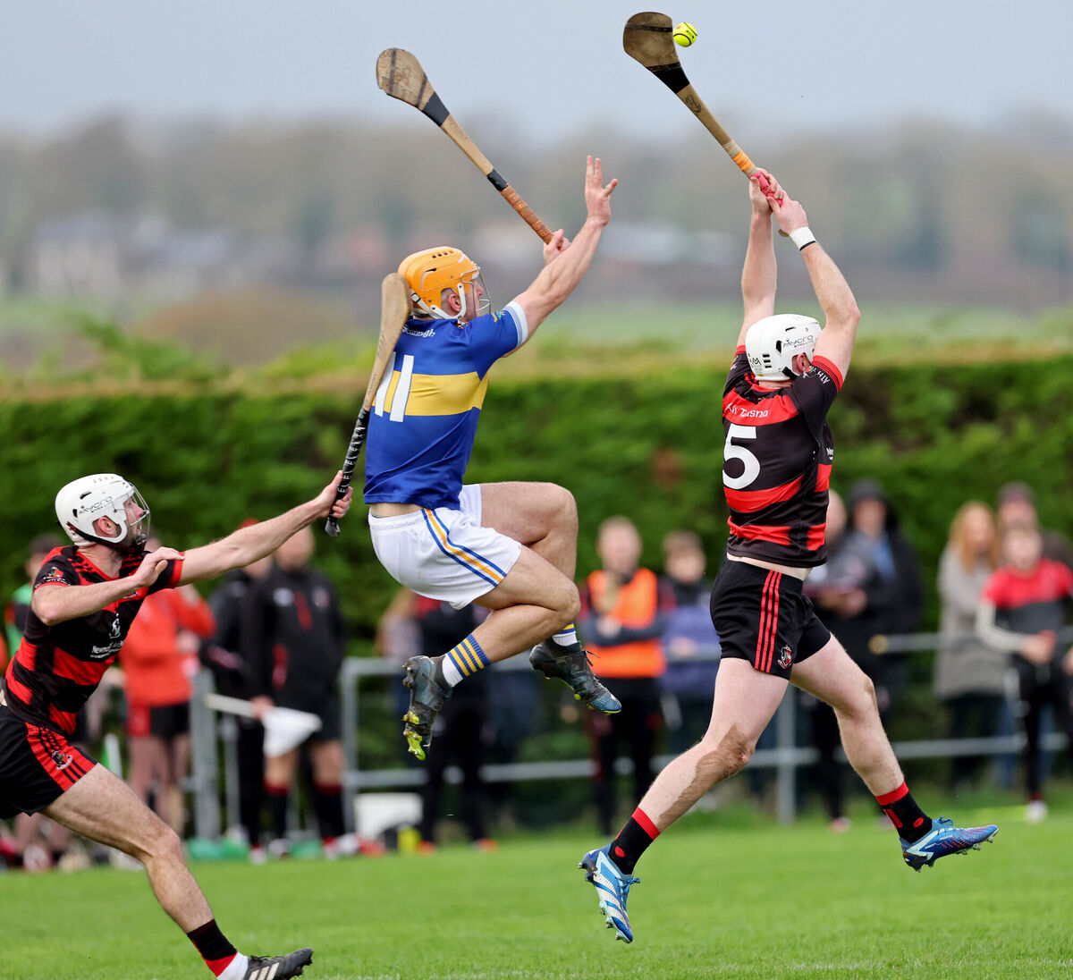 MY BALL: Aidan Browne and Alan Ryan, Newmarket, battling Jack Twomey, Kilshannig. Picture: Jim Coughlan.