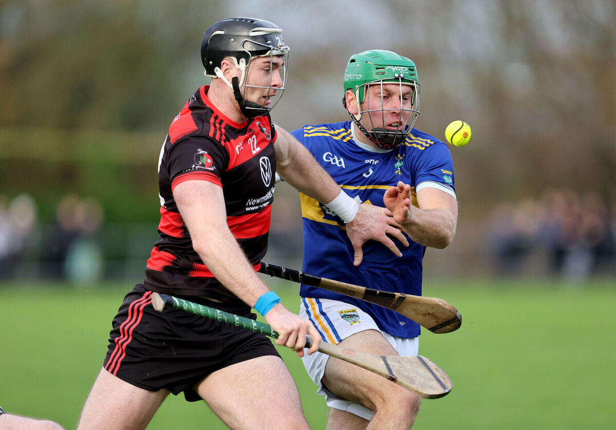  Josh O'Keeffe, Newmarket, under pressure from Darragh O'Sullivan, Kilshannig. Picture: Jim Coughlan.
