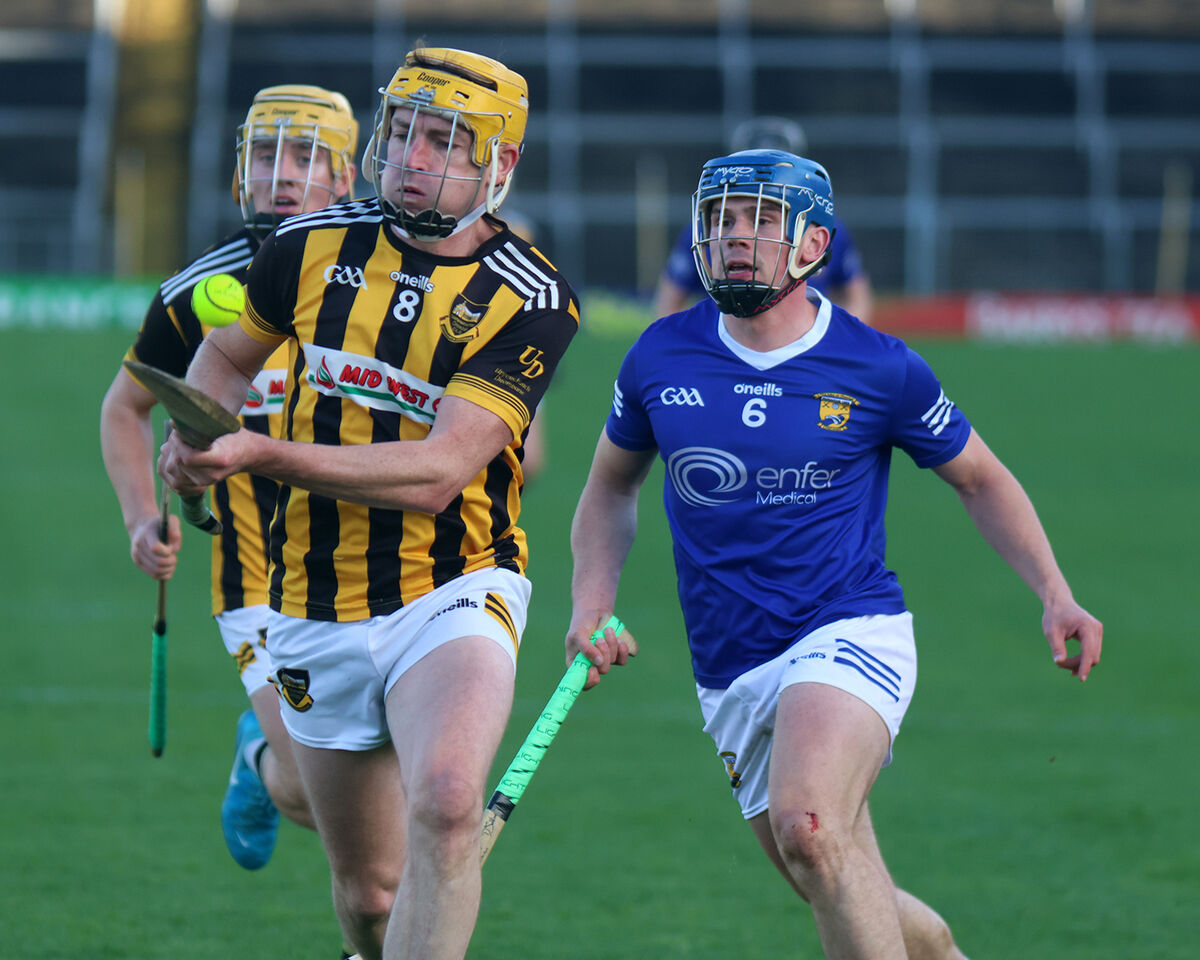 Upperchurch's Diarmuid Grant drives out ahead of Darragh O'Sullivan, Ballinhassig. Picture: Brendan Gleeson