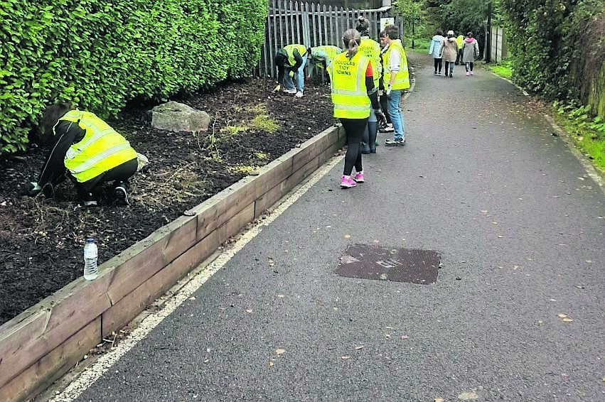Employees of American open-source software company firm Red Hat after clearing weeds and planting bulbs at the Donnybrook Hill entrance to Ballybrack Woods on Wednesday, November 5. 	 Picture: Douglas Tidy Towns
                    