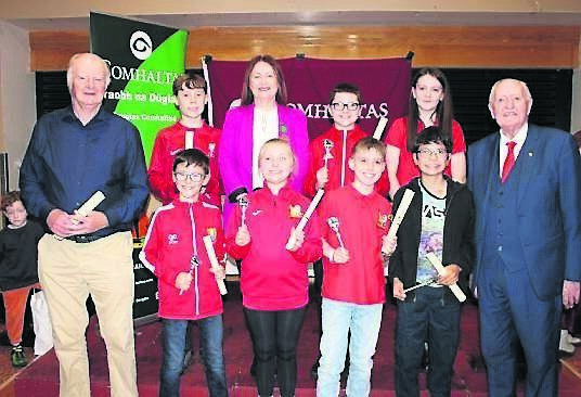 Comhaltas na Dúglaise SCT award recipients: front: Tim O’Sullivan, committee member and SCT awardee; Cillian Morrissey, Áine Flynn Farrell, ALex Kennedy, David Clark SCT Awards and Barry Cogan Cathaoirleach Craobh na Dúglaise. Back: James Mehigan, Attracta Brady, national president Comhaltas; Ryann Flynn Farrell and Aoibhinn O’Driscoll.