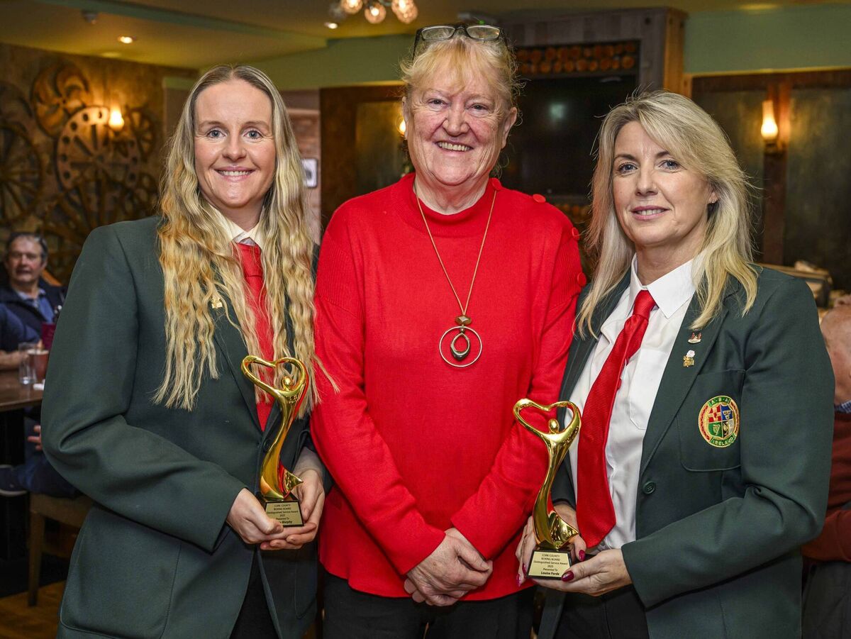 Caitríona Twomey of Cork Penny Dinners presenting Nicola Murphy and Louise Forde with Distinguished Service awards in recognition of their outstanding work on behalf of Cork Boxing at the Muskerry Arms. Picture: Doug Minihane
