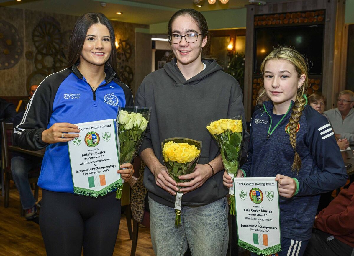 Cork Boxing: Senior Elite champion Linda Desmond of Rylane BC presenting Katelyn Butler of St Colman's BC and Ellie Murray of Golden Gloves BC with pennants to mark their international appearances for Ireland at this year’s European Championships. Picture: Doug Minihane
