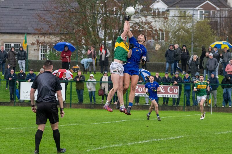 Clonmel Commercials’ Joe Higgins and St Finbarr’s Brian Hayes rise high to contest possession. Picture: Chani Anderson. Clonmel Commercials’ Joe Higgins and St Finbarr’s Brian Hayes rise high to contest possession. Picture: Chani Anderson.