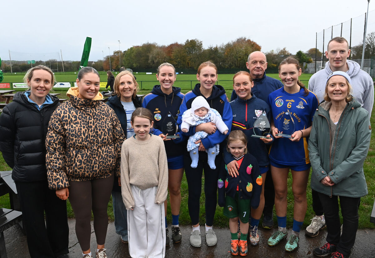 Sisters Kate, Orlaith, and Meabh Cahalane of St Finbarr's Camogie Club and Éire Óg Ladies Football Club with family at the presentation of their awards after winning both senior club championship titles in one weekend recently.  Picture: Larry Cummins
