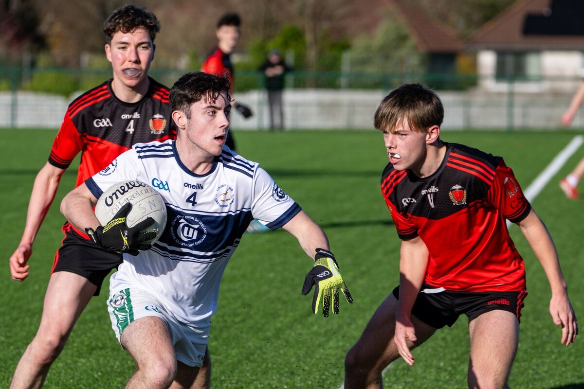 Coláiste Choilm’s Ethan Donovan tries to get away from Donagh McGuirk of Spioraid Naoimh. Picture: Chani Anderson.