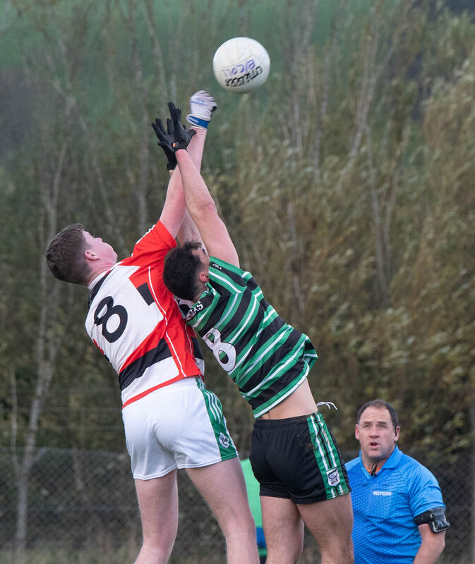 Ballincollig's Brian Moore and David Buckley of Douglas reach out for the dropping ball this season. Picture: Howard Crowdy