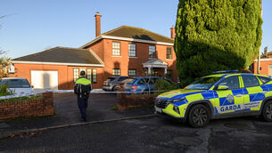 <p> A Garda on duty outsite the Gallagher family home at Shrewsbury Downs, Ballinlough, Cork. Picture Dan Linehan</p>