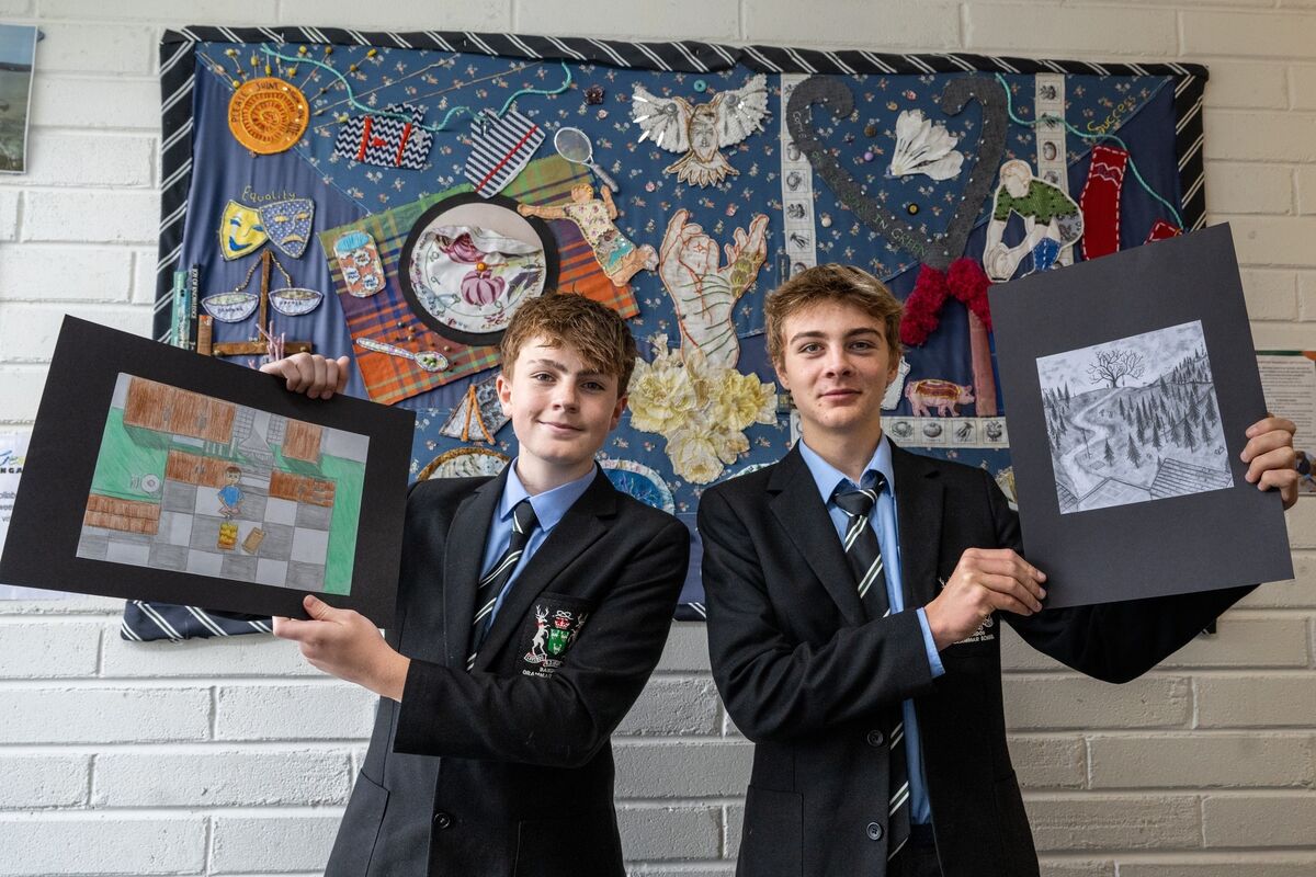 Ryan Farrell and Wolfie Tyndale, Bandon Grammar School students, pictured with their artwork for the fiction section of this year’s Holly Bough. Picture: Chani Anderson