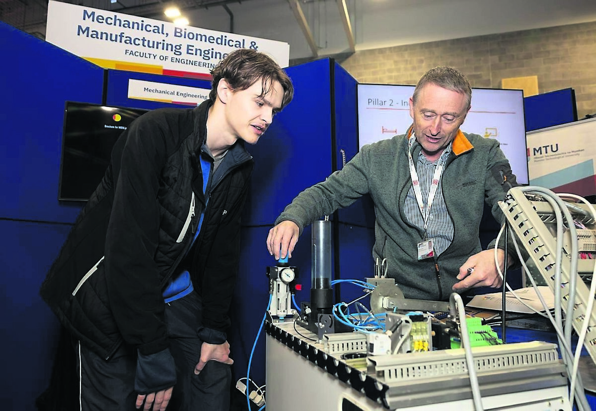Shane Fitzgerald from Crosshaven with mechanical engineering lecturer Fergus Delaney at the MTU Bishopstown campus open day.	Picture: Darragh Kane
                    